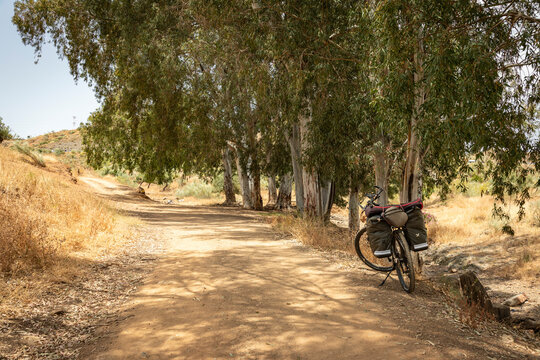 Camino Mozarabe de Santiago - a touring bicycle at arroyo de las Canas in Puerto de la Torre, Malaga, Andalusia, Spain