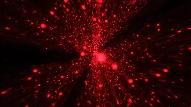 Vibrant red particles explode outward in a mesmerizing display of light.