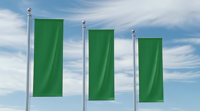 Three blank vertical green banners elegantly displayed on silver flagpoles against a bright blue sky with wispy white clouds