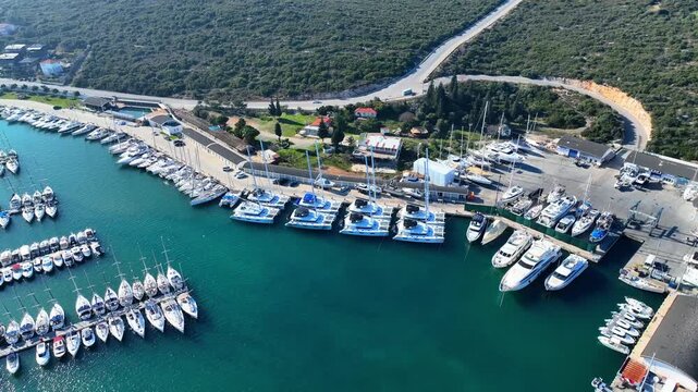 Peaceful Aerial View of Teos Marina and Sığacık, Izmir Turkey - Aerial view of Teos Marina and Sığacık in Izmir, Turkey, featuring a peaceful harbor, boats and clear blue Aegean Sea.