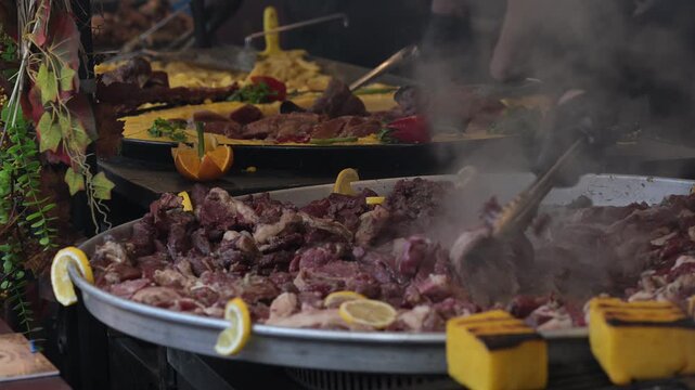 Large cooking pot with meat and vegetables at a market in Romania during the day