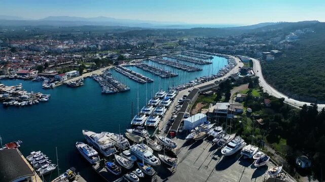 Peaceful Aerial View of Teos Marina and Sığacık, Izmir Turkey - Aerial view of Teos Marina and Sığacık in Izmir, Turkey, featuring a peaceful harbor, boats and clear blue Aegean Sea.