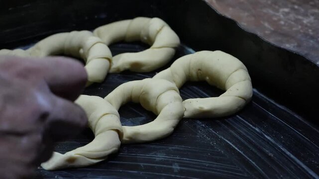 baker making argentinian croissant