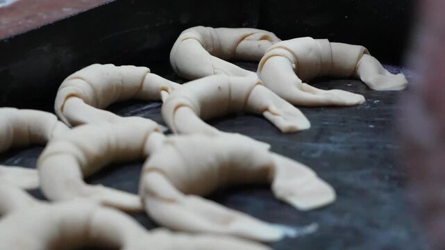 baker making argentinian croissant