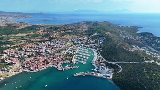 Peaceful Aerial View of Teos Marina and Sığacık, Izmir Turkey - Aerial view of Teos Marina and Sığacık in Izmir, Turkey, featuring a peaceful harbor, boats and clear blue Aegean Sea.