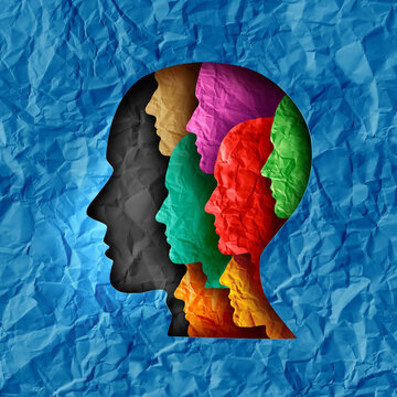 Group Support Concept and community help or collective therapy and team leadership or leader teamwork as human head profiles made of paper as a metaphor for common vision and unity.