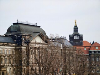 Ancient style building with trees. Historical architecture with winter ambiance and artistic details © Vladimir