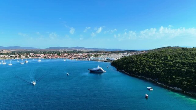 Peaceful Aerial View of Teos Marina and Sığacık, Izmir Turkey - Aerial view of Teos Marina and Sığacık in Izmir, Turkey, featuring a peaceful harbor, boats and clear blue Aegean Sea.