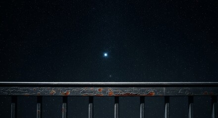 Fototapeta premium A sturdy metal railing overlooks a vast dark sky filled with shimmering stars, capturing the quiet and pensive mood of a deep sleepless night, stars, universe, dark