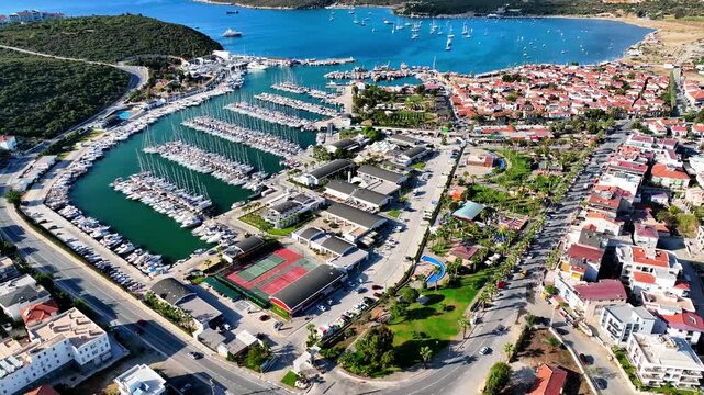 Peaceful Aerial View of Teos Marina and Sığacık, Izmir Turkey - Aerial view of Teos Marina and Sığacık in Izmir, Turkey, featuring a peaceful harbor, boats and clear blue Aegean Sea.
