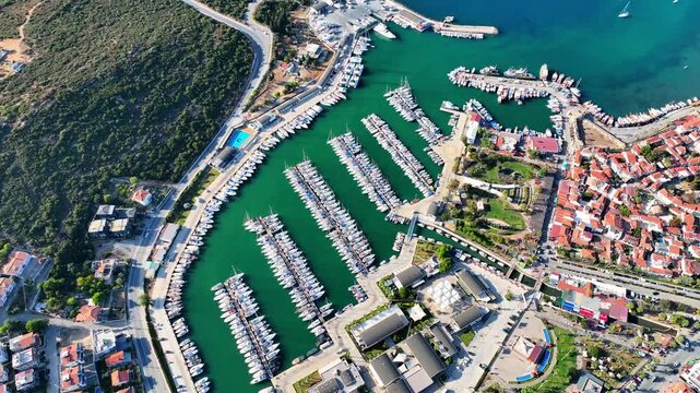 Peaceful Aerial View of Teos Marina and Sığacık, Izmir Turkey - Aerial view of Teos Marina and Sığacık in Izmir, Turkey, featuring a peaceful harbor, boats and clear blue Aegean Sea.
