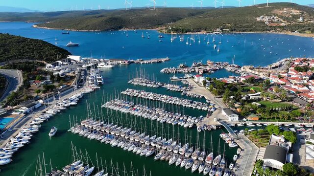Peaceful Aerial View of Teos Marina and Sığacık, Izmir Turkey - Aerial view of Teos Marina and Sığacık in Izmir, Turkey, featuring a peaceful harbor, boats and clear blue Aegean Sea.