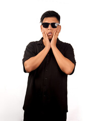Obraz premium Young man touching cheeks with shocked expression isolated on white background 
