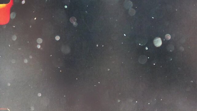 Floating dust particles glistening in a sunbeam