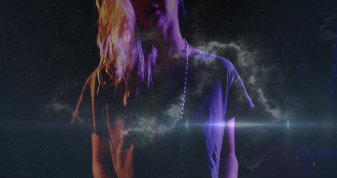 Woman musician playing synth sparking nebula flares, cam rising casting stars on face for portrait