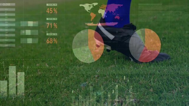 Male player placing cleat by ball on grass toe touching rolling activating sports HUD pie charts