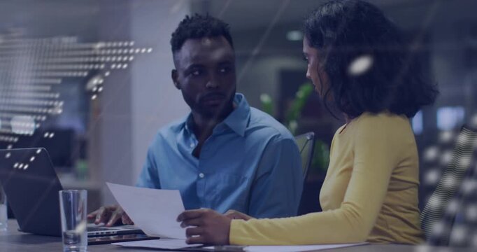 Woman showing paper to man at laptop, initiating review, map and tech overlay shifting across faces