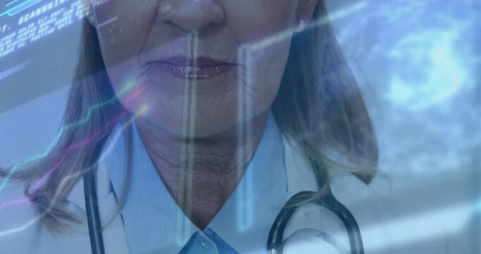 Vertical video: Reacting to graphics senior MD smiling in clinic wearing lab coat and stethoscope