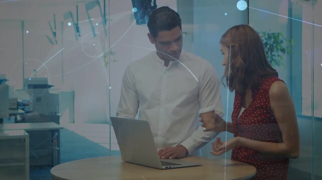 Woman reaching keyboard typing on laptop, man checking business data moving overlays marking screen
