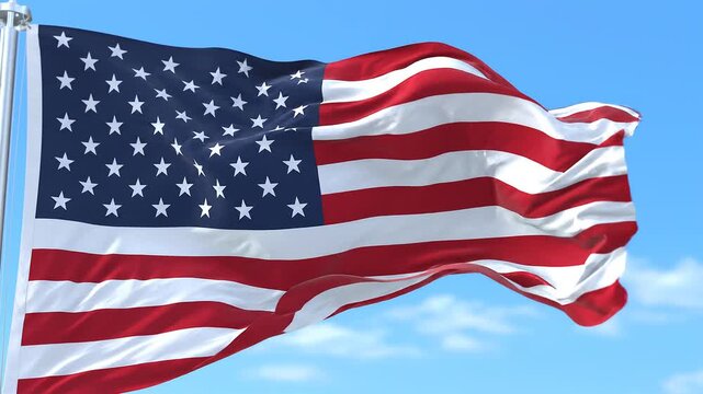 American Flag Waving in Breeze, Blue Sky Background, Patriotic Symbolism