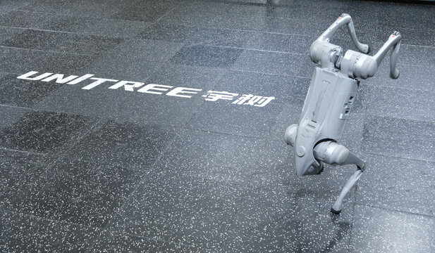 Shanghai,China-March 15th 2026: Unitree quadruped robot performing a handstand featuring the company logo