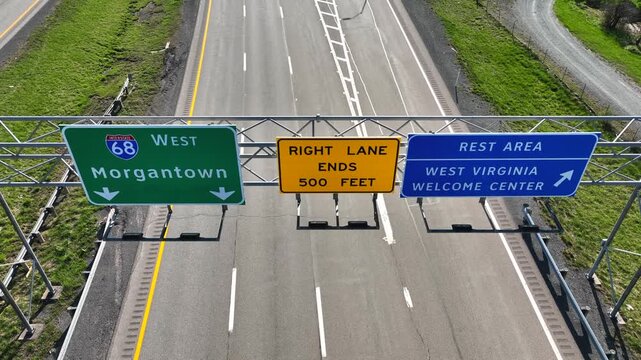 Aerial view of highway signs directing traffic toward Morgantown and rest area