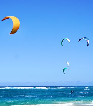 Kiteboarding Kites float gracefully over Kite Beach in Cabarete, Dominican Republic