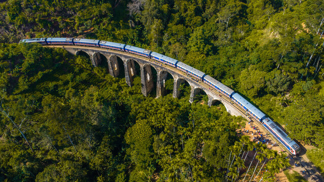 The Nine Arch Bridge also called the Bridge in the Sky in Sri Lanka and one of the best examples of colonial-era railway construction in the country. It's railway bridge. Train on the bridge.