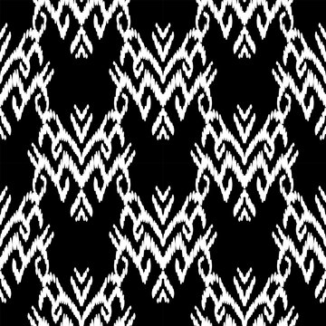 "A hand-crafted seamless pattern inspired by traditional Ikat and tribal textiles. The design features intricate damask-style motifs drawn with intentional organic strokes to create a natural, woven t