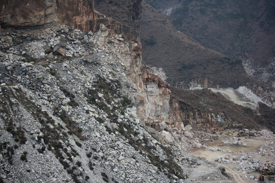 Large-scale marble quarry and stone extraction site in the mountainous region of Swat, Pakistan.