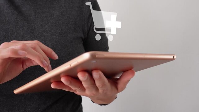 Close-up of a businesswoman interacting with her tablet, featuring an animated shopping icon with an "add" button. Add more products to your cart.