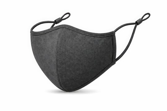 Black face mask with elastic ear straps and adjustable toggles isolated on white background