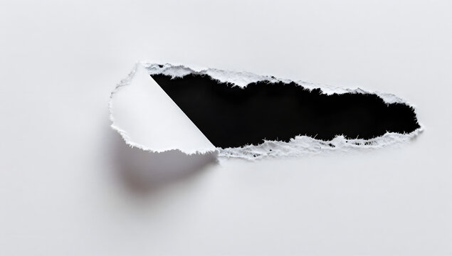 Ripped paper unveils dark void: A stark white surface tears away to reveal a mysterious abyss. The interplay of light and shadow creates a dramatic visual, inviting curiosity.
