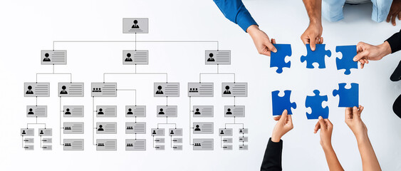 Illustrative teamwork concept showcasing hands assembling puzzle pieces adjacent to an...