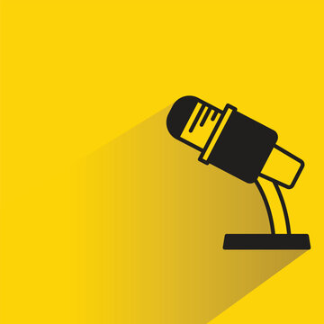 mic on stand icon with drop shadow on yellow background