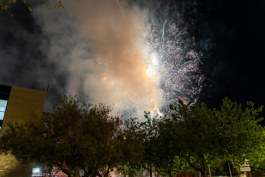 Denia Alicante Spain   Great smoke caused by the explosion of hundreds of firecrackers fired in the traditional mascleta by night at the festival of Fallas