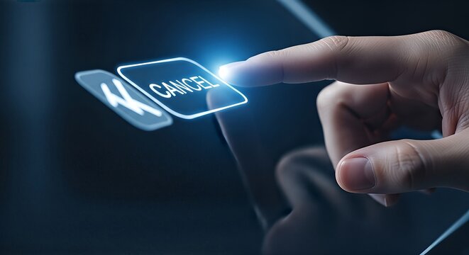 Close-up of a hand touching a glowing cancel button on a digital screen.