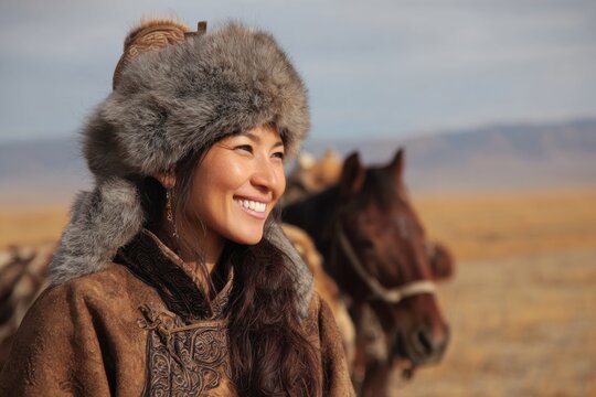 Smiling Mongolian Woman in Deel
