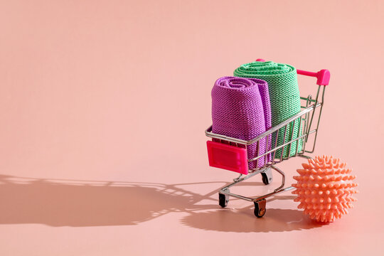 Shopping cart carrying rolled resistance bands and massage ball