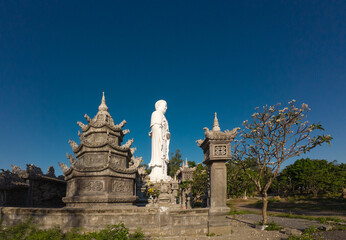 Standing Buddha statue against sky at Tong Lam Son Temple Nha Trang Vietnam