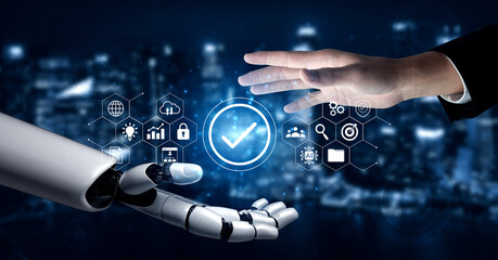 A captivating image showcases a human hand reaching toward a robotic arm, depicting the seamless...