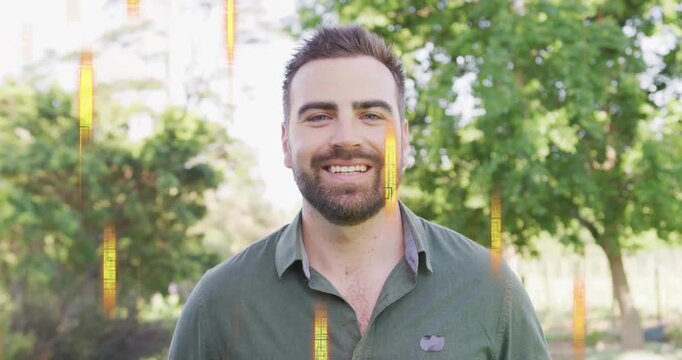 Man standing in park, smile widening as golden streaks sliding across face sparking marketing