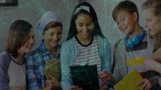 Teen holding tablet and tapping, peers leaning in and pointing, sharing school content
