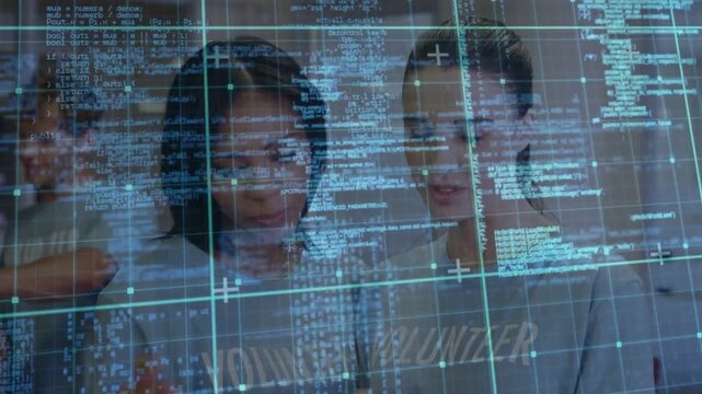 Two women tapping handheld device and reviewing software, digital code grid animating around screen