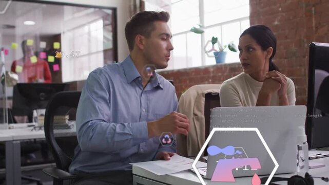 Coworkers reviewing biz data at desk man tapping report pointing laptop hex icons marking charts