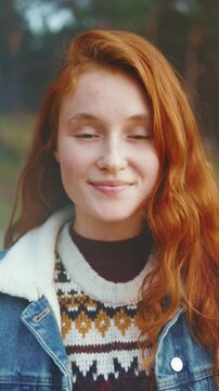 Contemplative person with freckles, Individual with freckled face in gentle lighting demonstrates introspection