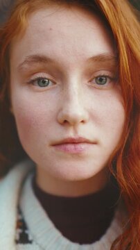 Contemplative person with freckles, Individual with freckled face in gentle lighting demonstrates introspection