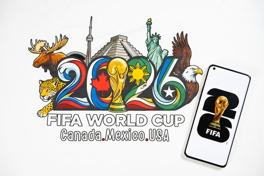 ZHONGSHAN China-March 15 2026: T shirt with the 2026 FIFA World Cup figure and mobile with World Cup logo at horizontal composition.