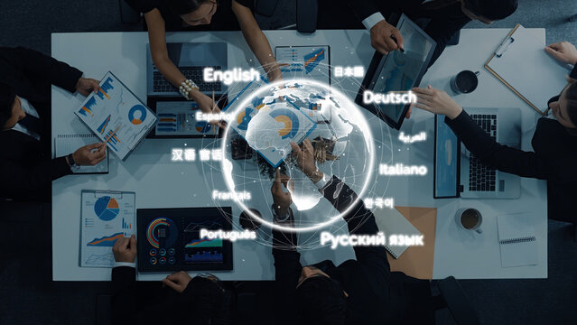 A diverse group of professionals collaborates in a modern office setting, analyzing global data with charts and technology while discussing strategies and ideas. Trope