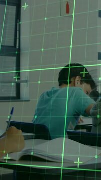 Vertical video: Student writing camera panning showing peers, green grid over frames for education